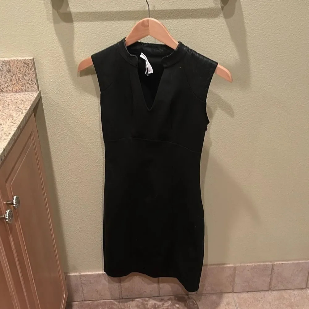BCBG black pencil dress with leather at the shoulders and neck